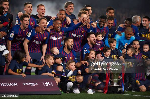 Barcelona players celebrate after Barcelona won their 26th league title at the end of the Spanish League football match between Barcelona and Levante...