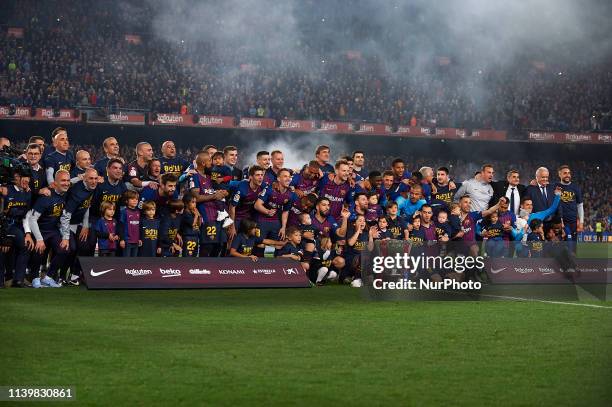 Barcelona players celebrate after Barcelona won their 26th league title at the end of the Spanish League football match between Barcelona and Levante...