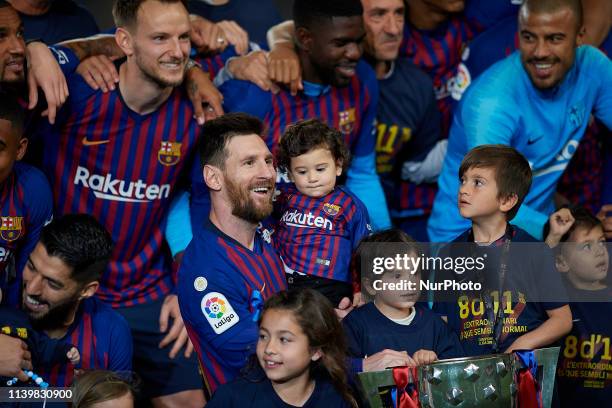 Lionel Messi of Barcelona whit his sons celebrate after Barcelona won their 26th league title at the end of the Spanish League football match between...