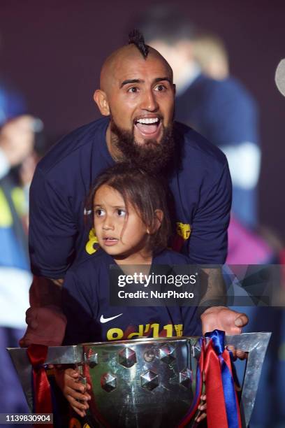 Arturo Vidal of Barcelona whit his sons celebrate after Barcelona won their 26th league title at the end of the Spanish League football match between...