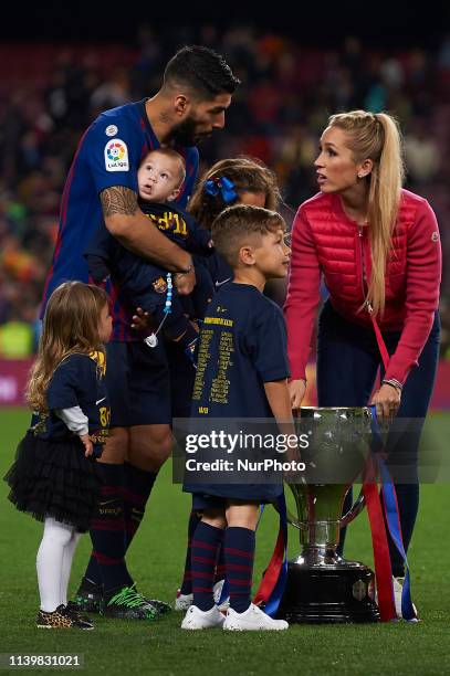 Luis Suarez and his family celebrates after Barcelona won their 26th league title at the end of the Spanish League football match between Barcelona...