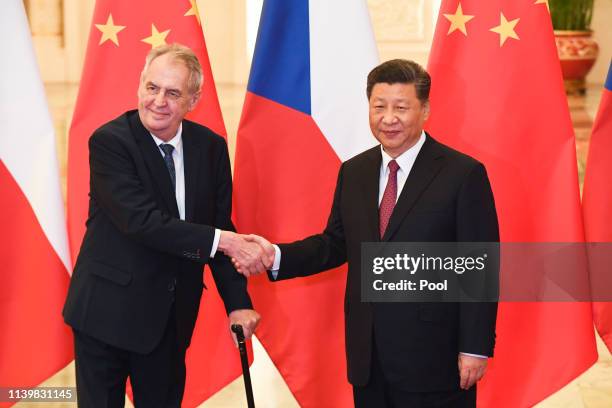 China's President Xi Jinping, right, shakes hands with Czech Republic's President Milos Zeman before their meeting at the Great Hall of the People on...