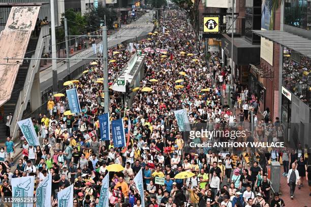 Activists attend a protest in Hong Kong on April 28 against a controversial move by the government to allow extraditions to the Chinese mainland. -...