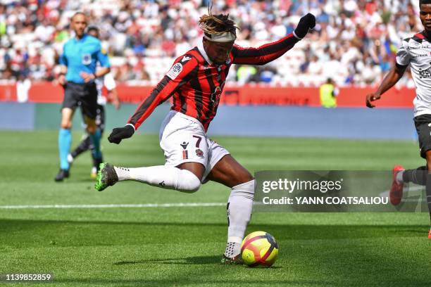 Nice's French forward Allan Saint-Maximin kicks the ball during the French L1 football match between OGC Nice and En Avant Guingamp at the Allianz...