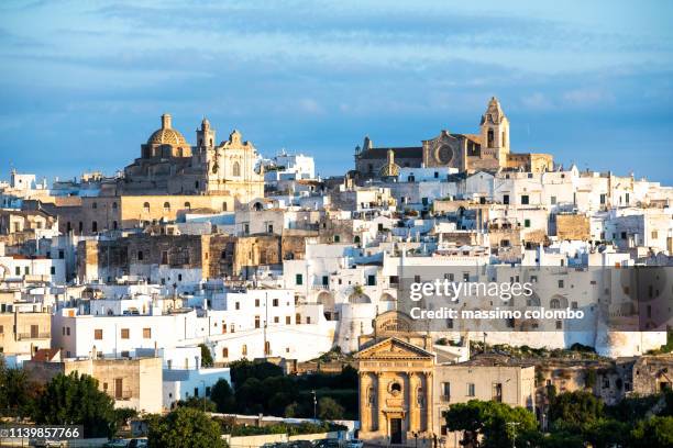 view of the city of ostuni, early morning light - puglia stock pictures, royalty-free photos & images
