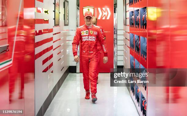 Mick Schumacher of Germany and Scuderia Ferrari SF90 walks out of the garage during F1 testing in Bahrain at Bahrain International Circuit on April...