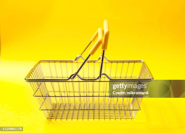 single empty shopping basket - empty super market shelf stock pictures, royalty-free photos & images
