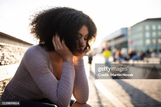 depressed lonely woman sitting in sorrow - girl ashamed stock pictures, royalty-free photos & images