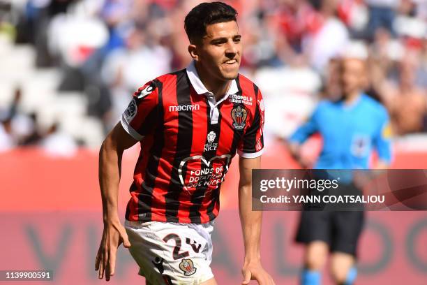 Nice's Algerian defender Youcef Atal celebrates after scoring his second goal during the French L1 football match between OGC Nice and En Avant...
