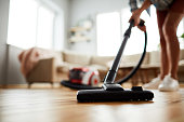 Vacuuming floor at home