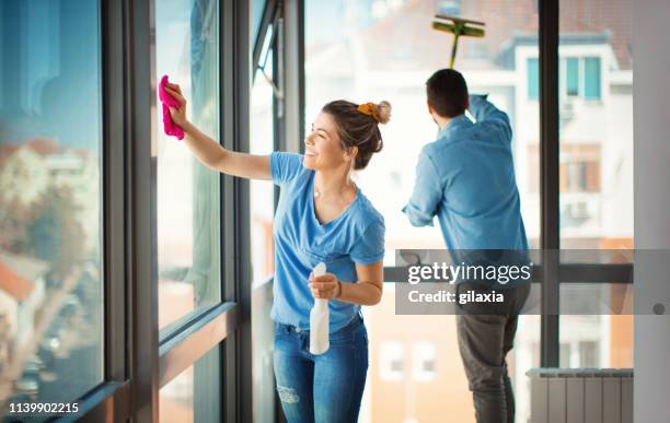 weekend chores. - washing windows stock pictures, royalty-free photos & images
