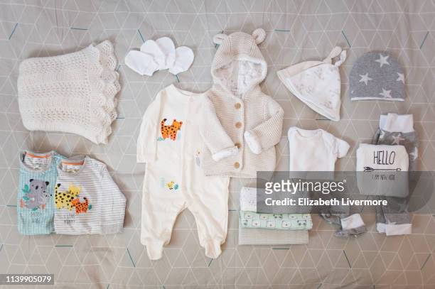 packing baby's hospital bag - baby clothes stock pictures, royalty-free photos & images