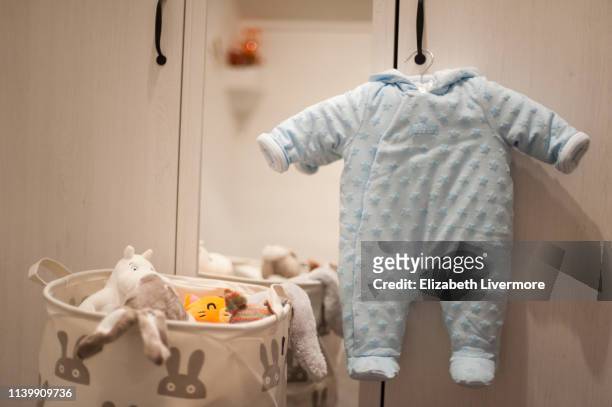 baby coat and plush toys - northern europe stock pictures, royalty-free photos & images