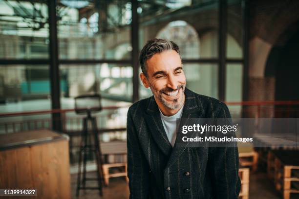 portrait of a handsome smiling man. - looking away stock pictures, royalty-free photos & images