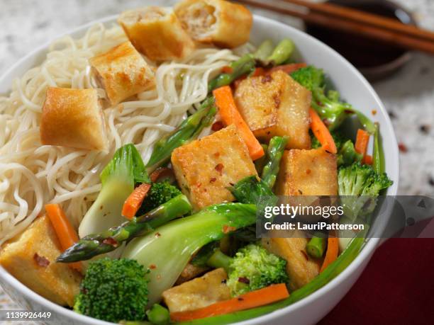 tofu noodle bowl with vegetable spring roll - noodle stock pictures, royalty-free photos & images