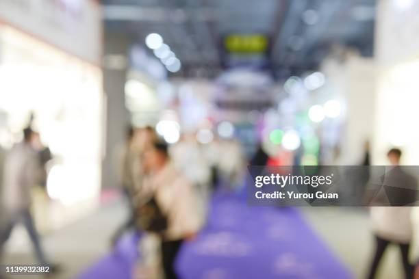 defocus background of public exhibition in trade show . abstract background used for business. - tradeshow ストックフォトと画像