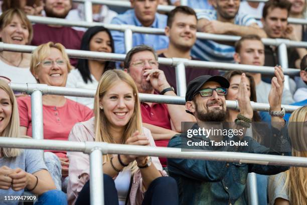 sport fans cheering on tribunes - tribune tower stock pictures, royalty-free photos & images