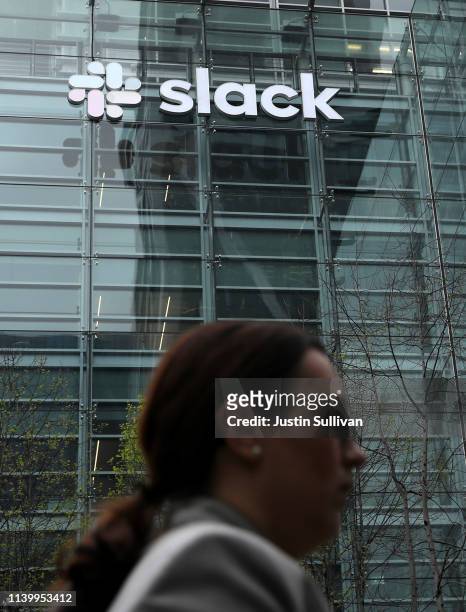Pedestrian walks by Slack headquarters on April 02, 2019 in San Francisco, California. Workplace messaging company Slack Technologies Inc. Announced...