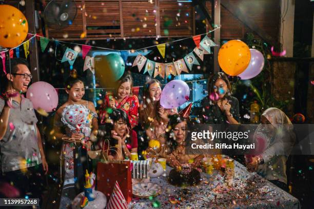 group of friends celebrating birthday together - birthday stock pictures, royalty-free photos & images