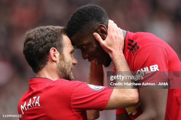 Juan Mata of Manchester United celebrates after scoring a goal to make it 1-0 with Paul Pogba during the Premier League match between Manchester...