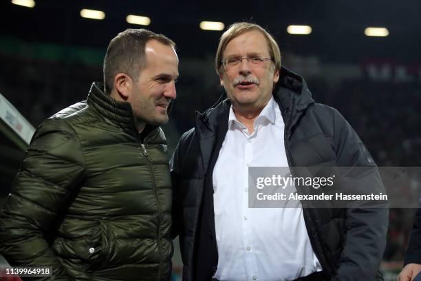 Manuel Baum Head Coach of FC Augsburg talks to Rainer Koch den Vize President of the DFB Cup prior to the match between FC Augsburg and RB Leipzig at...