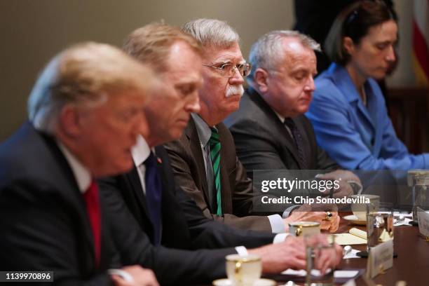 National Security Advisor John Bolton joins President Donald Trump and NATO Secretary General Jens Stoltenberg during a bilateral meeting in the...