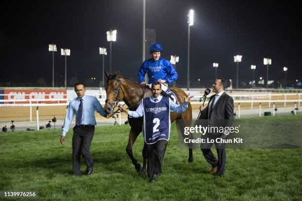 William Buick riding Old Persian wins the Longines Dubai Sheema Classic during the Dubai World Cup Day at Meydan Racecourse on March 30, 2019 in...