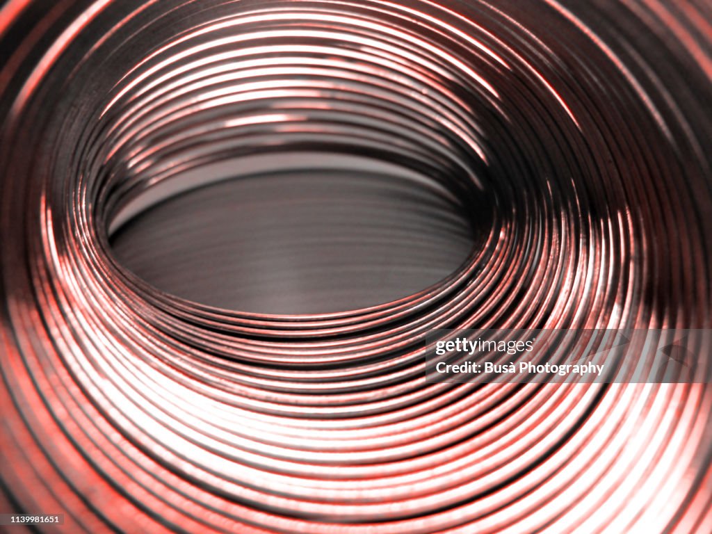 Helical Coil Spring close-up (color manipulation with Living Coral Pantone, color of the year 2019)