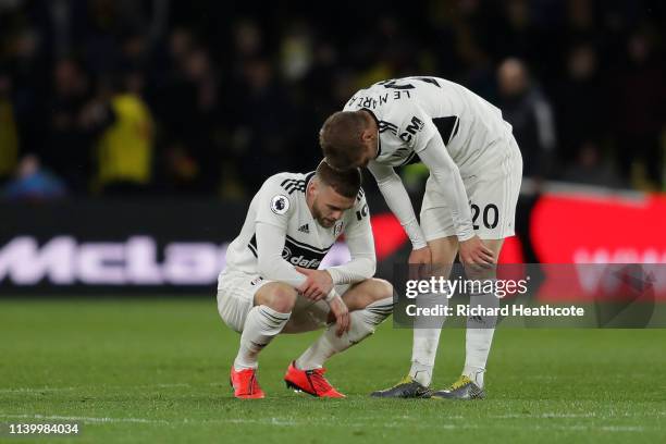 Calum Chambers and Maxime Le Marchand of Fulham look dejected after their team are relegated following the result in the Premier League match between...