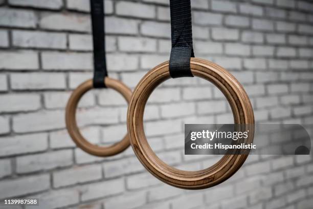 close up of gymnastic rings at the gym - gymnastics equipment stock pictures, royalty-free photos & images