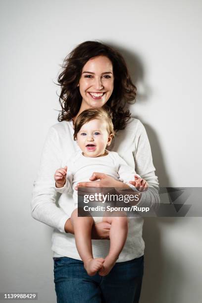 happy portrait of mother and baby boy - mom holding baby stock-fotos und bilder