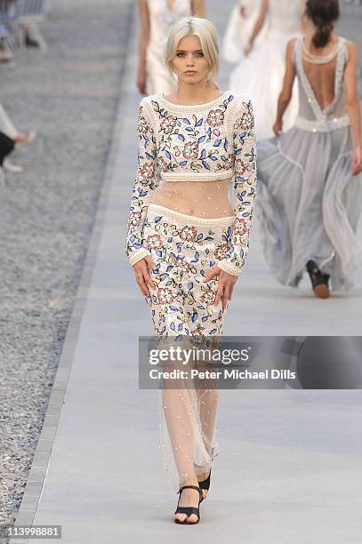 Model walks the runway during the Chanel Collection Croisiere Show 2011-12 at the Hotel du Cap on May 9, 2011 in Cap d'Antibes, France.