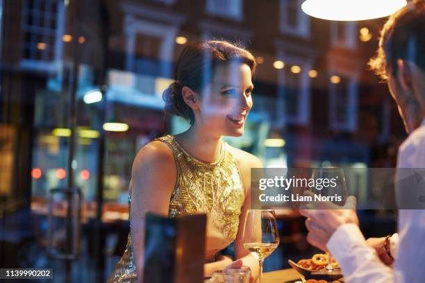 couple in restaurant - glamour couple stock pictures, royalty-free photos & images