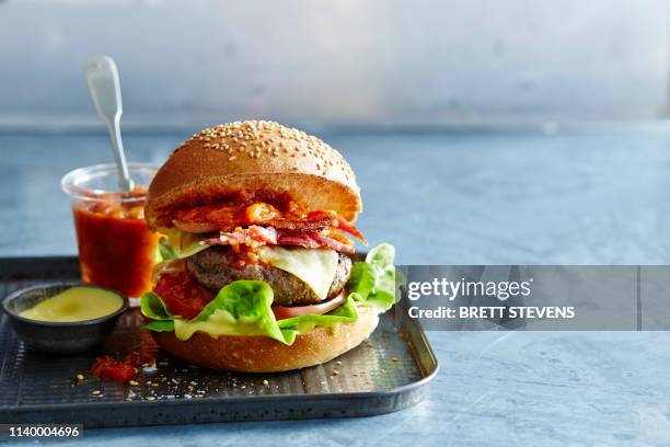 beef burger with spicy ketchup and mustard mayonnaise - relish stock pictures, royalty-free photos & images