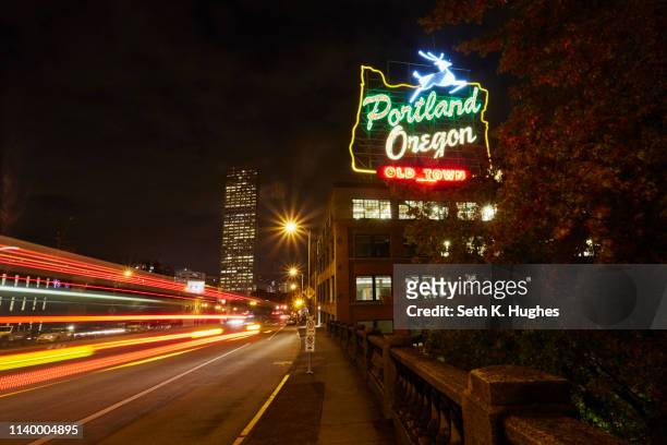 highway and neon sign at night, portland, oregon, usa - portland neon sign stock pictures, royalty-free photos & images
