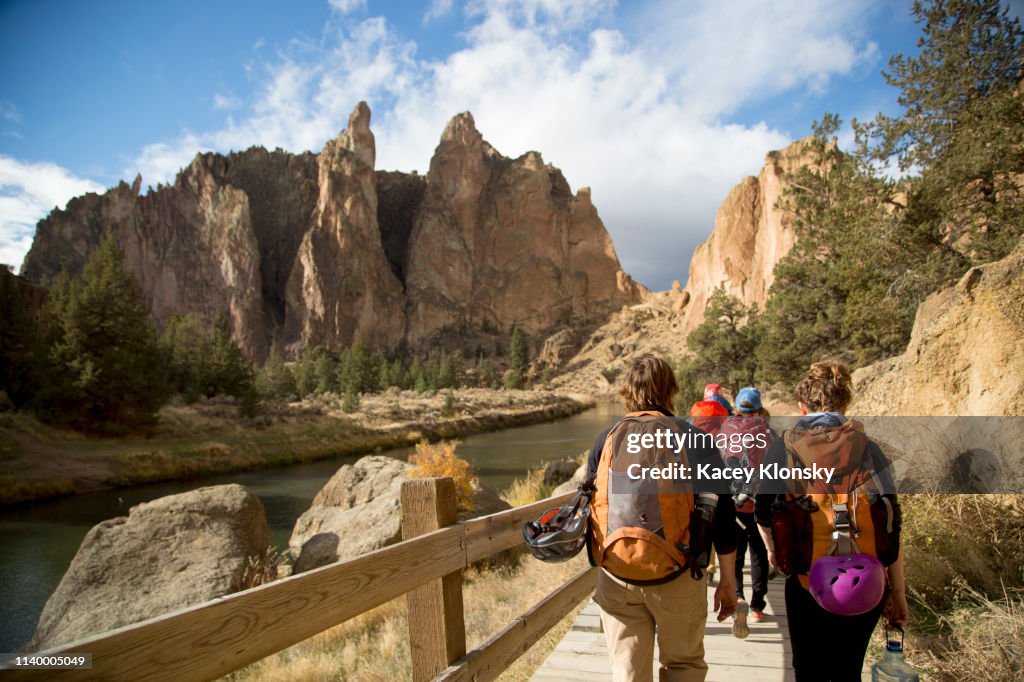 Hikers walking on track, Smith Rock State Park, Oregon, US