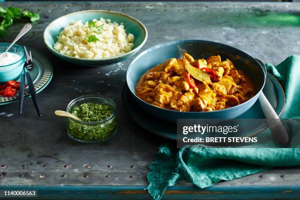 indian coconut chicken curry, cauliflower rice - indian food stock pictures, royalty-free photos & images