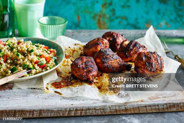 smoked paprika chicken legs, pearl couscous - chicken drumsticks stock pictures, royalty-free photos & images