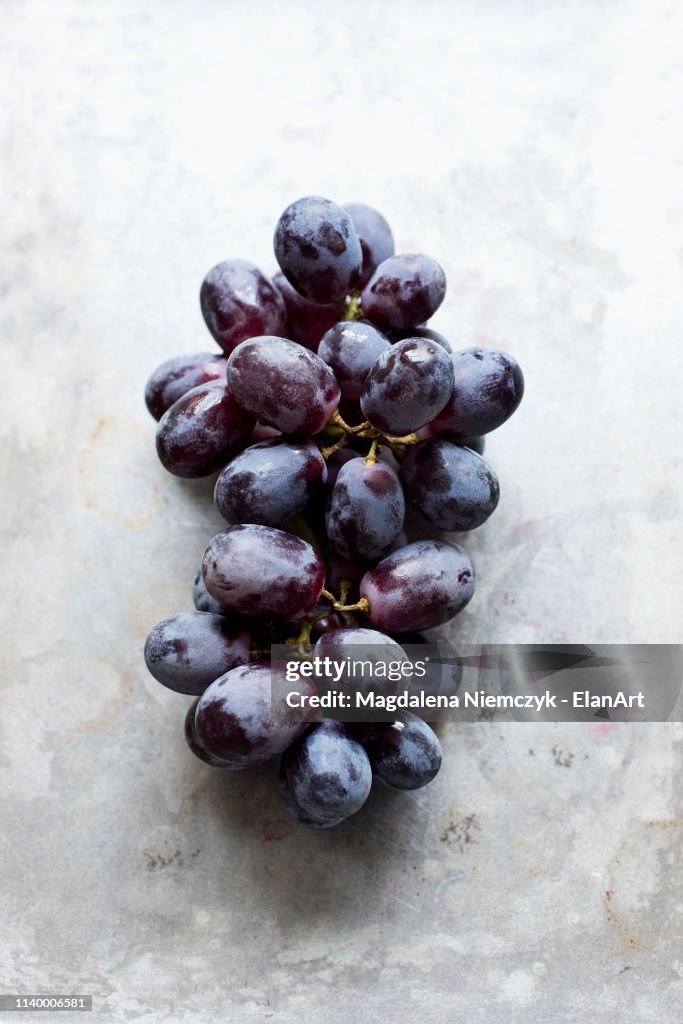 Fresh grapes on a silver background