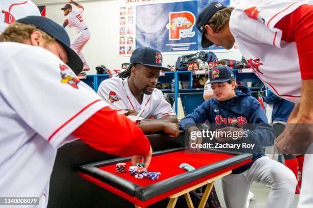 Members of the Portland Sea Dogs play a friendly game of poker on media day at Hadlock Field on April 2, 2019 in Portland, Maine.