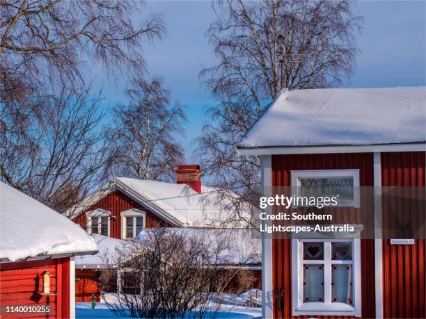 a mid-winter street view in the historic village of gammelstaden, near lulea, northern sweden. - lulea - fotografias e filmes do acervo