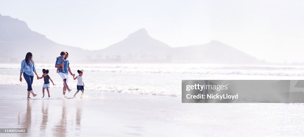 Playful family on the beach