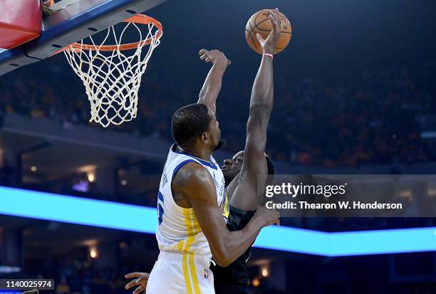 Kevin Durant of the Golden State Warriors blocks the attempted dunk of Clint Capela of the Houston Rockets during Game One of the Second Round of the...