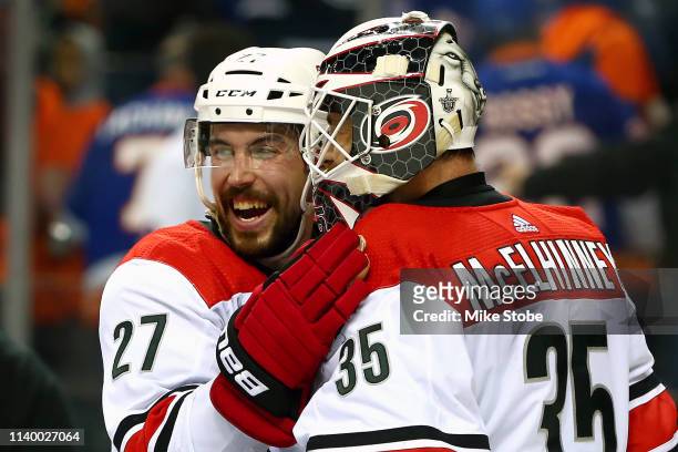 Curtis McElhinney is congratulated by his teammate Justin Faulk after their 2-1 win over the New York Islanders in Game Two of the Eastern Conference...
