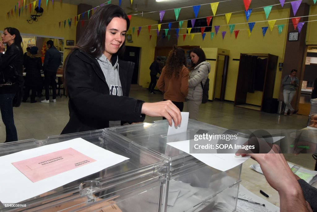 A voter seen casting her vote at a polling station during...