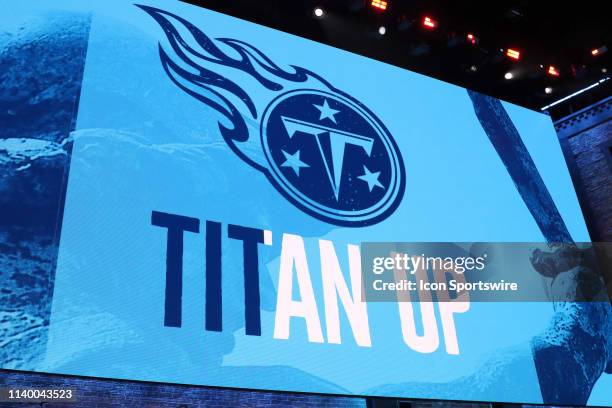 The video board shows the logo for the Tennessee Titans during the first round of the 2019 NFL Draft on April 25 at the Draft Main Stage on Lower...