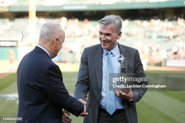 Oakland Athletics Executive Vice President of Baseball Operations Billy Bean accepts an award for 2018 MLB Executive of the Year before the game...