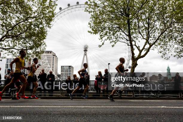 Athletes pass London Eye during the Virgin Money London Marathon in London, England on April 28, 2019. Nearly 43 thousand runners participated in...