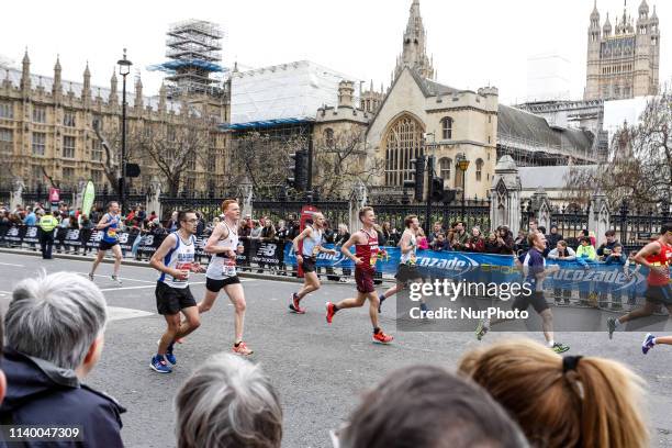 Athletes pass Westminster during the Virgin Money London Marathon in London, England on April 28, 2019. Nearly 43 thousand runners participated in...