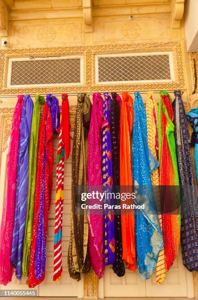beautiful colorful women dupatta hanging on walls - dupatta stock pictures, royalty-free photos & images